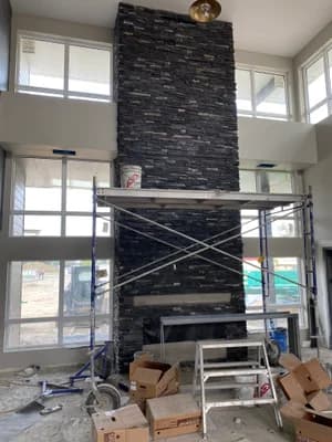 Grand stacked stone fireplace - full view
